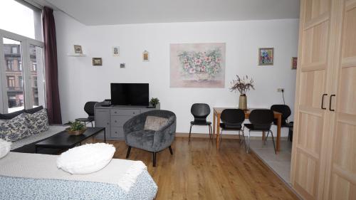 TV a/nebo společenská místnost v ubytování Sint-Jans Appartments