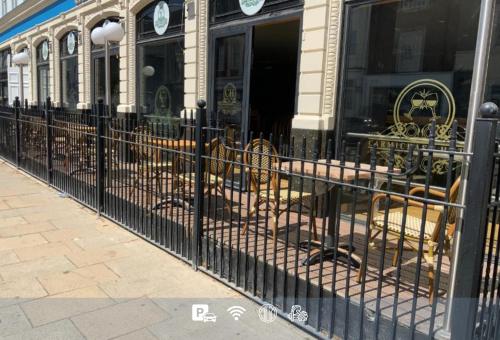 a wrought iron fence in front of a store at The Carmichael - Hull City Centre in Hull