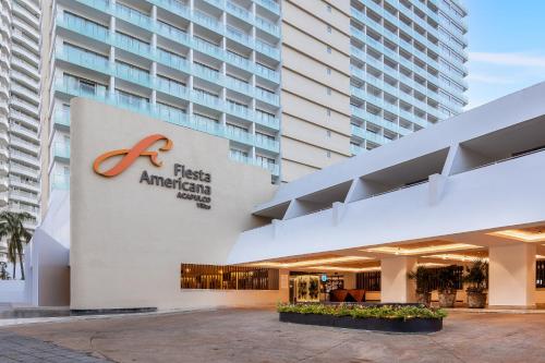 a building with a first american hotel at Fiesta Americana Acapulco Villas in Acapulco