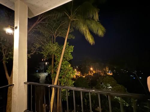 a view from a balcony at night at Tanouy Garden in Baan Khai