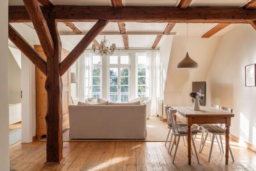 a living room with a white couch and a table at Gut Brook in Brook