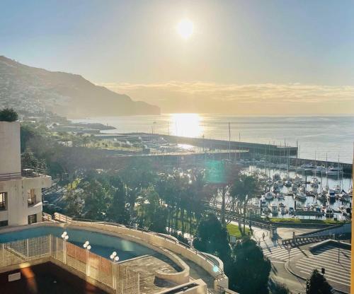a view of a city and the ocean from a building at Center Marina View Brown Studio in Funchal