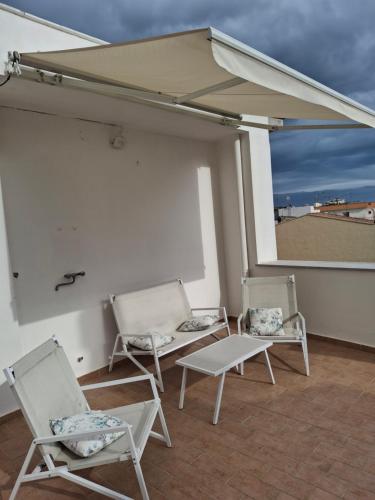 a group of chairs sitting on a roof at Casa del sole in Montalbano Jonico