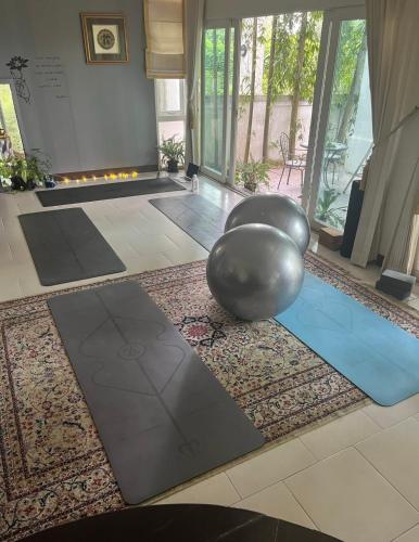 a room with a yoga ball on the floor at Garden and Yoga Stay in Ban Wat Sadet (1)