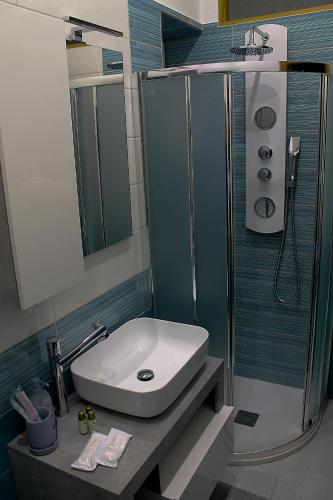 a bathroom with a sink and a shower at Residenza Noè in Antica Villa - Suite & Spa in Fisciano
