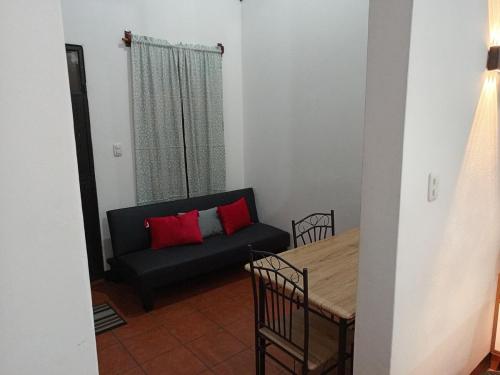 a living room with a couch and a table at Apartment T46 in Antigua Guatemala