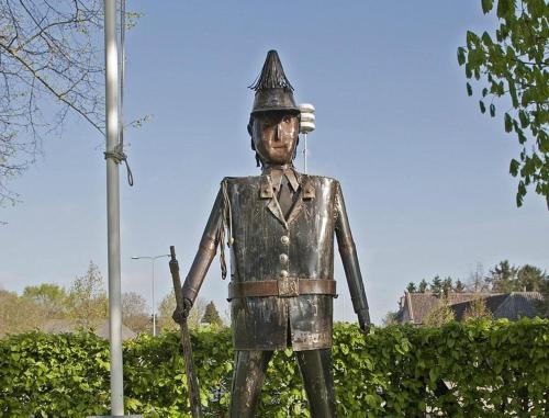 a statue of a man in a suit and helmet at BelleVie Apartment, Eijsden-Maastricht in Eijsden