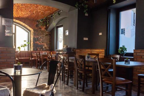 a restaurant with tables and chairs in a room at Gostišče Pod Kostanji in Dobrna