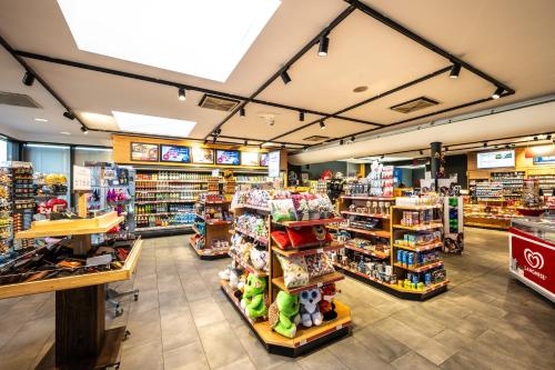 a store aisle with many products on display at Hotel Irschenberg Süd in Irschenberg