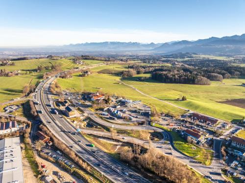 an aerial view of a city with train tracks at Hotel Irschenberg Süd in Irschenberg