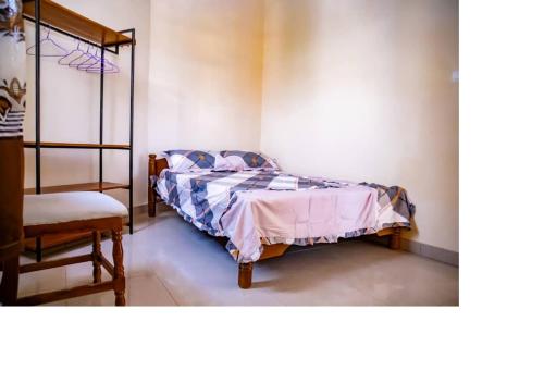 Un ou plusieurs lits dans un hébergement de l'établissement Bujumbura Hotel and Appartment