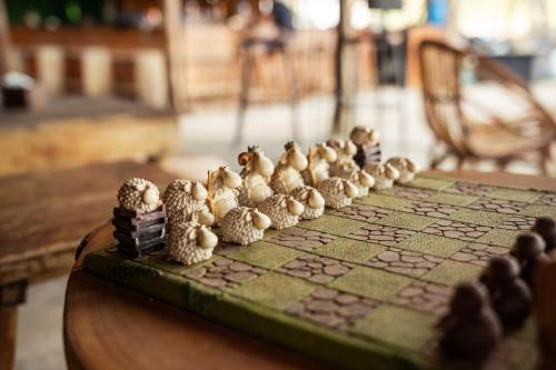 a board game with mushrooms on a table at Koalama Cambodia in Koh Rong Sanloem