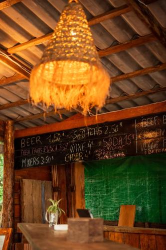 a chandelier hanging from the ceiling in a restaurant at Koalama Cambodia in Koh Rong Sanloem