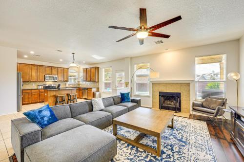 a living room with a couch and a fireplace at 5 Mi to Randolph AFB Spacious Cibolo Haven! in Cibolo
