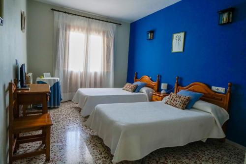 Posteľ alebo postele v izbe v ubytovaní Hotel Rural Familiar Almirez-Alpujarra
