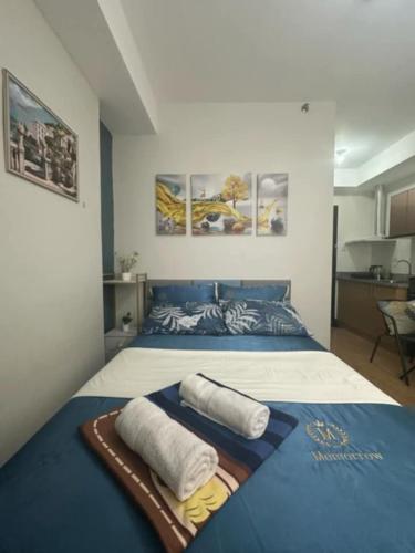 Ένα ή περισσότερα κρεβάτια σε δωμάτιο στο Cozy Studio Mesaverte CDO with Free Internet