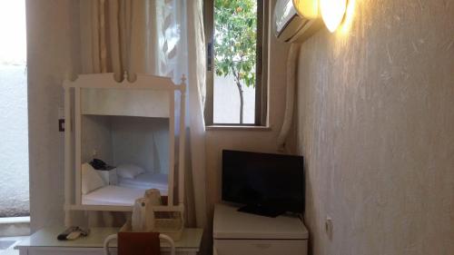 TV a/nebo společenská místnost v ubytování Rachel Hotel