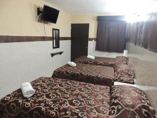 Giường trong phòng chung tại Hacienda Cañada Rica 2