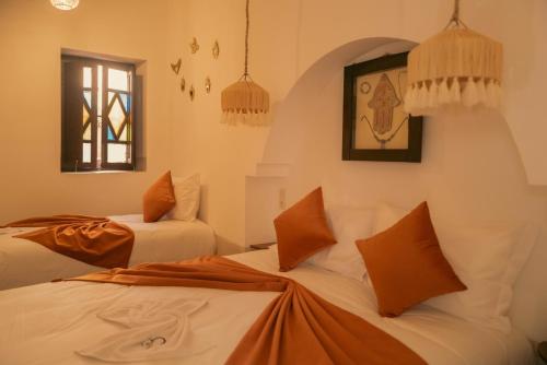 Riad julinesにあるベッド
