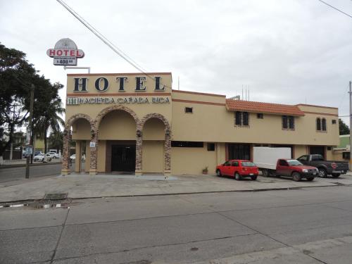 a hotel with a sign on the side of a street at Hacienda Cañada Rica 2 in Ciudad Madero