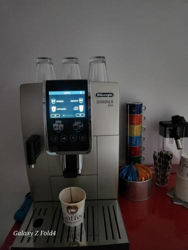 a coffee maker with a screen on top of it at B&B Regina Margherita in LʼAquila