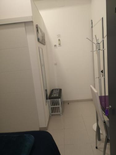 a hospital room with a treadmill in the corner of the room at Hostel de las Facultades in Santander