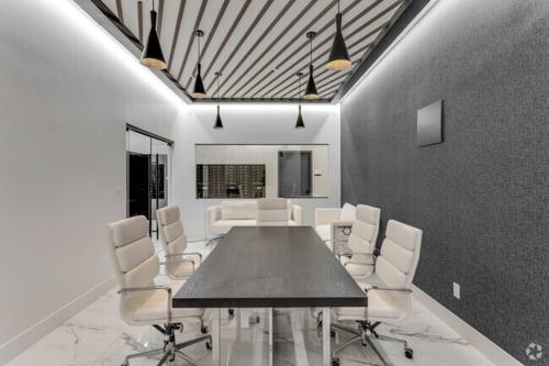 a dining room with a table and white chairs at Market View Residence 504 I 2 Bedroom 2 Bathroom in Wilmington