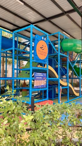 a playground with a slide in a building at Hotel Playa Blanca - San Antero in San Antero