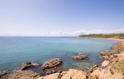 a large body of water with rocks in it at Awesome Apartment In Isola Capo Rizzuto in Isola Capo Rizzuto