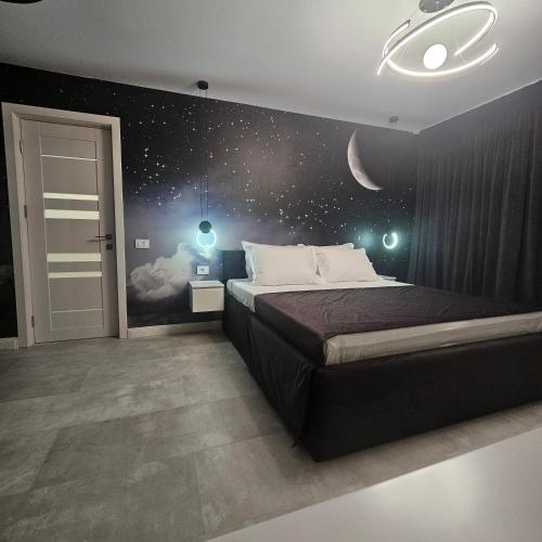 Postel nebo postele na pokoji v ubytování Galaxy Studio
