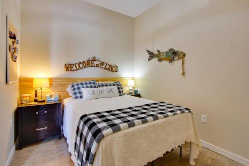 a bedroom with a bed with a checkered blanket at Waterfront Gem with Fire Pits and Dock in Georgetown in Georgetown