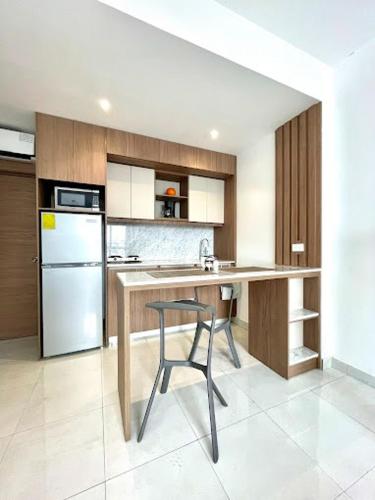 a kitchen with a table and a chair in it at Novapark Kennedy Hotel in Guayaquil