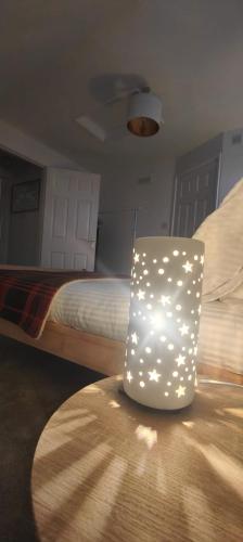 a white chair sitting on a table in a bedroom at Harnham Flat in Salisbury
