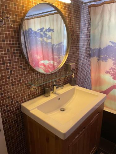 a bathroom with a sink and a mirror at Luxury-Elegant apartment in the heart of Patras​ in Patra