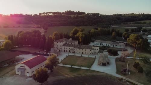 an aerial view of a large white building at Agriturismo Pieve San Biagio - Adults Only in Macerata