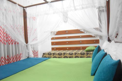 Postel nebo postele na pokoji v ubytování Lotus Leaf Resort