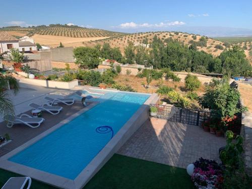a swimming pool in a villa with a view at Casa del olivo Lucio en Alomartes in Alomartes