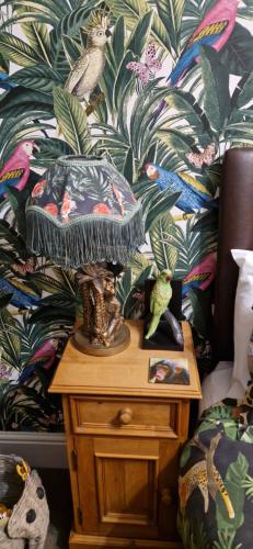 a lamp on a table with a bird on it at The Dudley Hotel in Blackpool