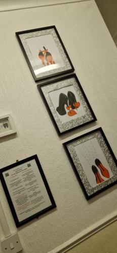 a group of pictures hanging on a wall at The Dudley Hotel in Blackpool