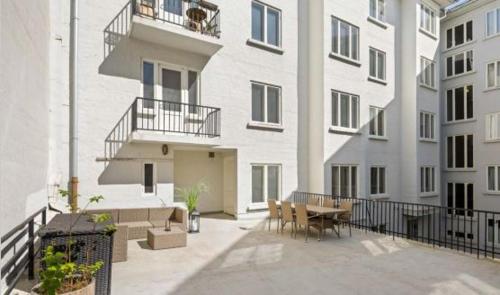 a balcony of a building with a table and chairs at Professor Dahls Gate 16 in Oslo