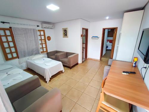 Ένα ή περισσότερα κρεβάτια σε δωμάτιο στο Vila Velluti Hotel