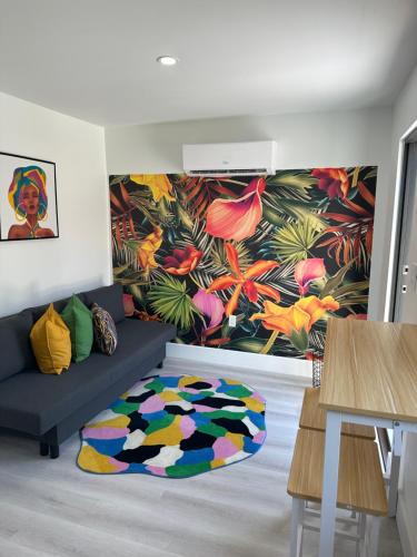 a living room with a couch and a flower mural at 5 Star Feel in Miami Prime Location in Miami