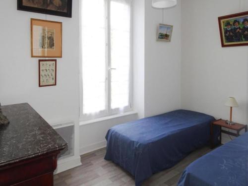 Ένα ή περισσότερα κρεβάτια σε δωμάτιο στο Apartment in Fouesnant by Sandy Cove