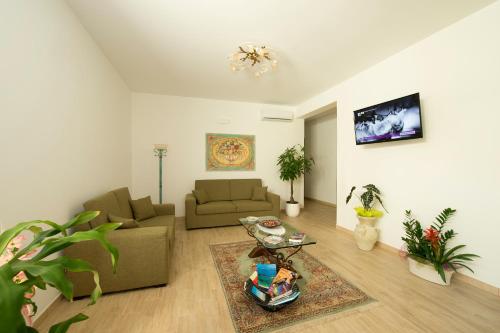 a living room with a couch and a table at I Segreti di Antonina in Castelluzzo