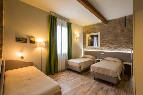 Tempat tidur dalam kamar di Hotel Residence Diamantina
