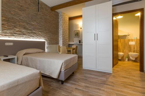 Ένα ή περισσότερα κρεβάτια σε δωμάτιο στο Hotel Residence Diamantina