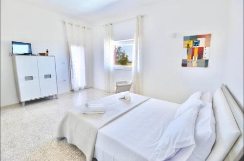 Ένα ή περισσότερα κρεβάτια σε δωμάτιο στο Casa Vacanza Boa Gialla Torre Guaceto