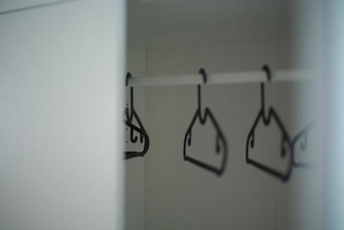 two bags hanging on a shelf in a bathroom at Clorofilla - Country House in Francavilla Angitola