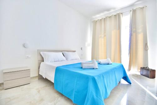 Ένα ή περισσότερα κρεβάτια σε δωμάτιο στο Casa Vacanza Boa Gialla Torre Guaceto