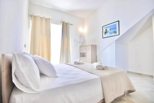 Ένα ή περισσότερα κρεβάτια σε δωμάτιο στο Casa Vacanza Boa Gialla Torre Guaceto